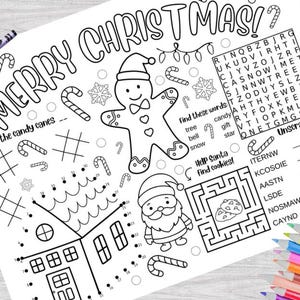 May include: A black and white printable Christmas activity sheet featuring a gingerbread man, Santa Claus, a house, candy canes, and a word search puzzle. The text on the sheet reads "Merry Christmas!" and "Count the candy canes".