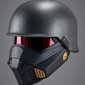 May include: A matte dark gray helmet featuring a smooth rounded dome, a deep red tinted visor, and a black lower face mask with gold-colored rectangular vents on the sides. The text OBSIDIAN cosplay.com is printed in white at the bottom center.