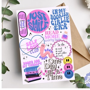 May include: A pink and blue illustrated card with the text "Just Smile", "Self Love Club", "Books Are My Therapy", "Read More Worry Less", "In My Bookish Girlie Era", "One Day At A Time", and "To Do: Read, Read, Get Coffee, Read".