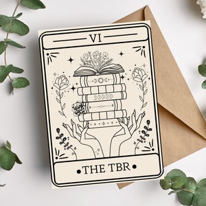 May include: A black and white illustration of a stack of books with flowers on top. The books are labeled "THE TBR" and "VI".
