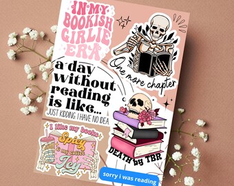 May include: A set of six stickers featuring a skeleton reading a book, a stack of books with a skull on top, and text that says "In my bookish girlie era", "One more chapter", "A day without reading is like... Just kidding, I have no idea", "I like my books spicy & my coffee icy", and "Death by TBR. Sorry I was reading."