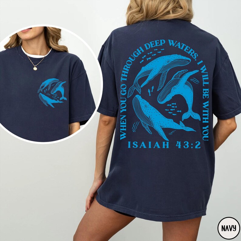 May include: Navy blue t-shirt with a graphic of whales and the text "When you go through deep waters, I will be with you. Isaiah 43:2"