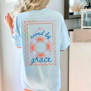 Christian Graphic Tee for Women Saved by Grace Shirt Scripture Shirt for Youth Group Church Outfit Modest Faith Based Apparel Gift for Her