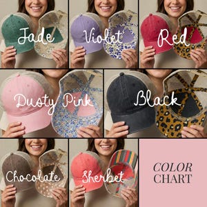 May include: A colour chart displaying trucker hats in various shades. The hats are available in jade, violet, red, dusty pink, black, chocolate, and sherbet. Each hat features a mesh back and a patterned or solid front.