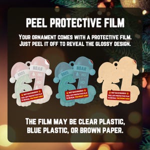 May include: Christmas ornaments shaped like the number 67, with a Santa hat and the name "Noah" and the year "2025". The ornaments are in pink, blue, and a tan color. The text on the ornaments says "Peel off protective film to reveal the front side".