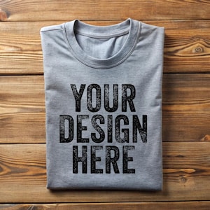 May include: A grey t-shirt with the text "YOUR DESIGN HERE" printed on the front.