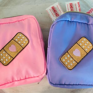 OUCH Band-Aid Bag, Mini First-Aid Kit pouch for small first-aid and safety supplies. Great for traveling, sports, backpack, diaper bags!