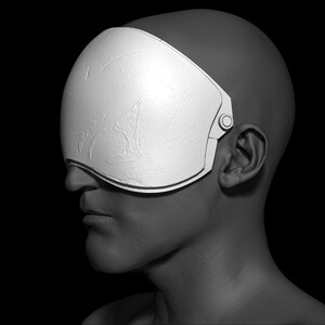 May include: A white, textured, curved visor covers the eyes of a 3D model of a person's head. The visor is attached to the head with a strap that goes around the back of the head.