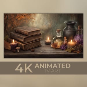 May include: A still-life image featuring a stack of antique books, lit candles, and glass bottles with cork stoppers. A dark vase and a small cluster of grapes are also present. The background shows a blurred autumn scene. The text "4K ANIMATED TV ART" is at the bottom.