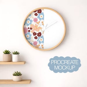 May include: A round wall clock with a light wood frame. The left side of the clock face features a floral pattern in shades of blue, pink, and burgundy. The right side is white. The clock hands are white.