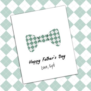 May include: A white card with a green and white checkered bow tie and the text "Happy Father's Day Love, Syd".