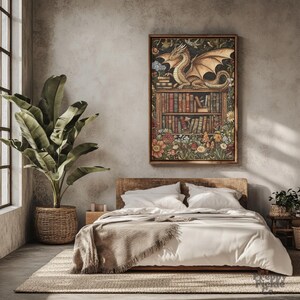 May include: A framed artwork featuring a dragon perched atop a bookshelf filled with books. The artwork is surrounded by colorful flowers and foliage. The room includes a bed with white linens, a woven rug, and a large potted plant.