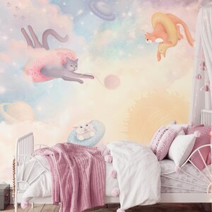 May include: A pastel pink, blue, and yellow children's bedroom with a white canopy bed. The wall is decorated with a mural of cats and a sun. The mural features a cat riding a donut, a cat riding a ring, and a cat playing with a ball of yarn.