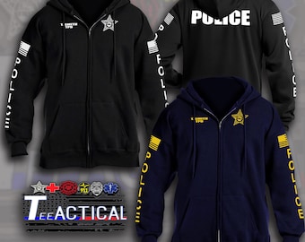 May include: Black and navy blue zip-up hoodies with "POLICE" printed on the sleeves and back. Each hoodie features a star badge and the text "T. SMITH TPD". The hoodies are displayed with a "Tee Tactical" logo.