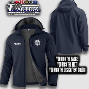 May include: Navy blue softshell jacket with a hood, featuring the word "POLICE" and a badge on the front. The jacket has a zipper closure and multiple pockets. The text "TEE TACTICAL" is at the top. The image also includes the text "YOU PICK THE BADGE! YOU PICK THE TEXT! YOU PICK THE DESIGN/TEXT COLOR!"