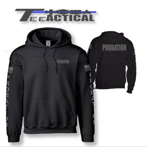 May include: Black hooded sweatshirt with the word "PROBATION" printed on the front and sleeves. The sleeves also feature a stylized American flag design.