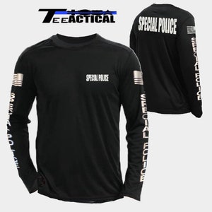 May include: Black long-sleeve shirt with reflective silver lettering that reads "SPECIAL POLICE" on the front and back. The shirt also has a reflective silver American flag on the left sleeve and the words "SPECIAL POLICE" repeated down the right sleeve.