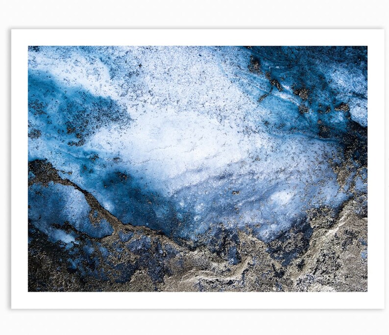 May include: Abstract art print featuring a blue and silver marble design. The background is a light blue with darker blue and silver swirls and streaks.