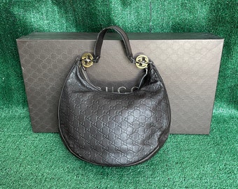 Gucci GG donkerbruine leren Hobo-schoudertas met reliëf