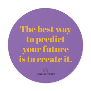 May include: Purple circle with a yellow inspirational quote that reads "The best way to predict your future is to create it." The quote is from the brand "stomping barefoot".