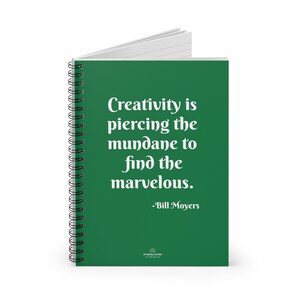 May include: A spiral-bound notebook with a green cover featuring the quote "Creativity is piercing the mundane to find the marvelous." by Bill Moyers in white text. The notebook has white lined pages and a black spiral binding.