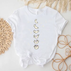 a white shirt with a picture of a baby on it