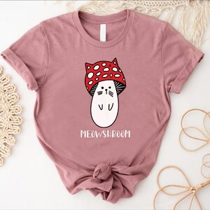 a t - shirt with a cartoon character wearing a red bow