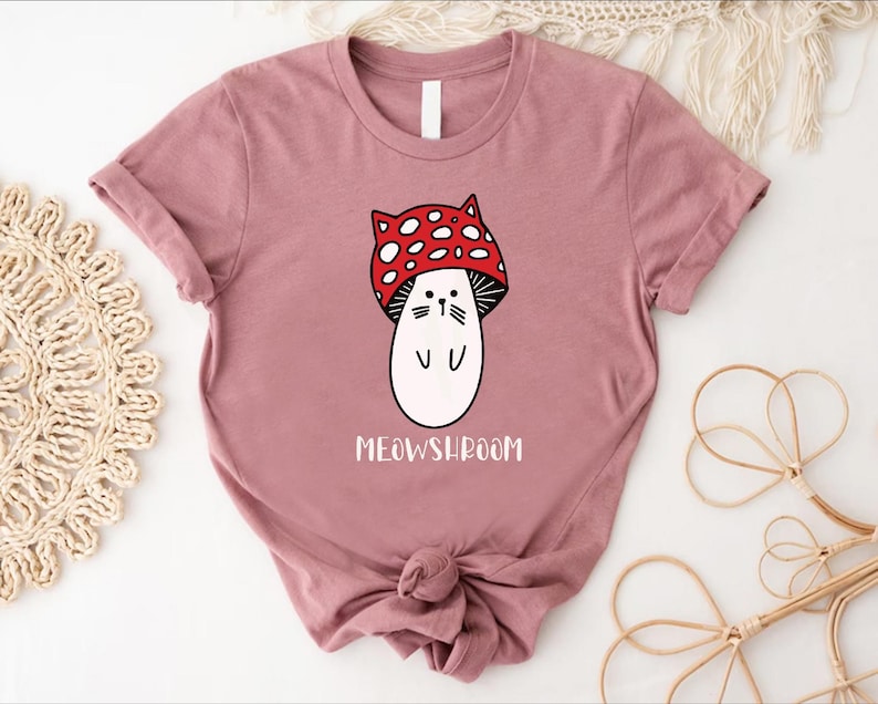 a t - shirt with a cartoon character wearing a red bow