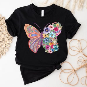 a t - shirt with a butterfly and flowers on it