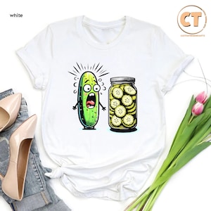 a t - shirt with a pickle and a jar of pickles on it