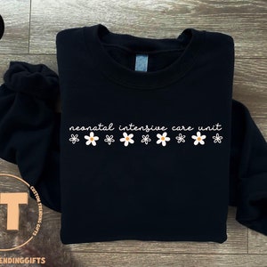 a black sweatshirt with the words remarkable adventure await on it