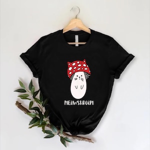 a black t - shirt with a white cat wearing a red bandana