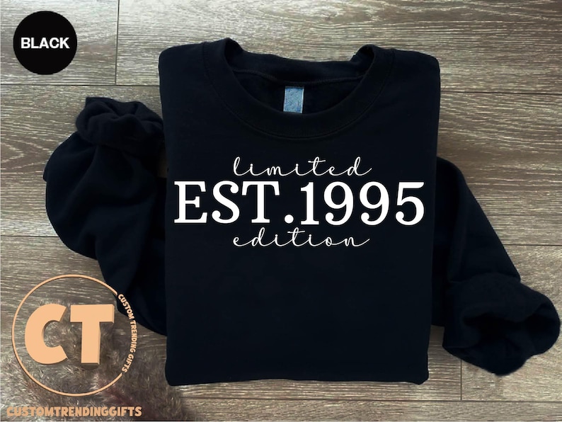 May include: Black sweatshirt with white text that reads "limited EST. 1995 edition".
