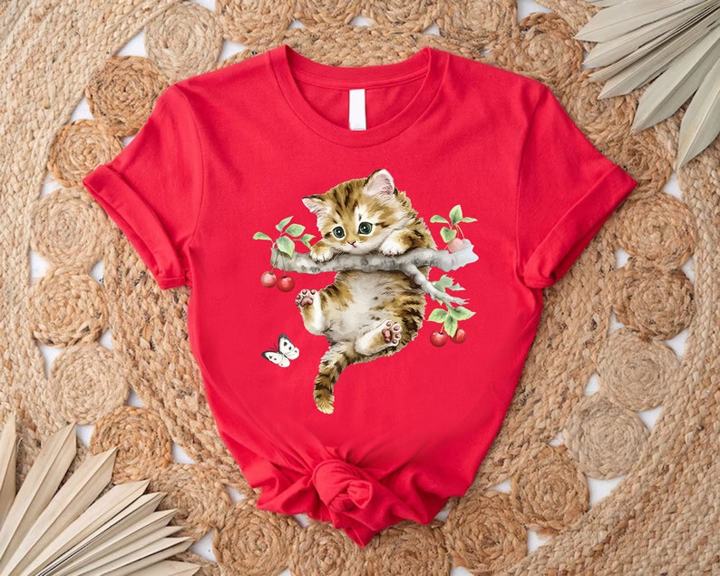 a red shirt with a cat on it