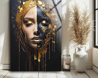 May include: Abstract portrait of a woman with half of her face painted black and the other half covered in gold leaf. The gold leaf drips down the side of her face, creating a dramatic effect.
