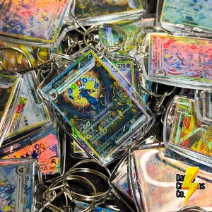ポケモン テラスタルフェスティバル イーブイ進化キーホルダー - ホログラフィックシャイニーチャーム - バックパック用かわいいアニメキーホルダー、ファンへのギフト、ポケモンカード無料