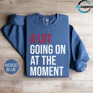 a blue sweatshirt that says alot going on at the moment
