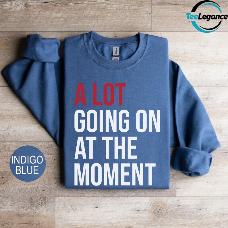 a blue sweatshirt that says alot going on at the moment