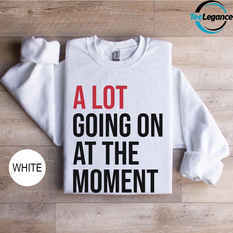 a white t - shirt that says a lot going on at the moment