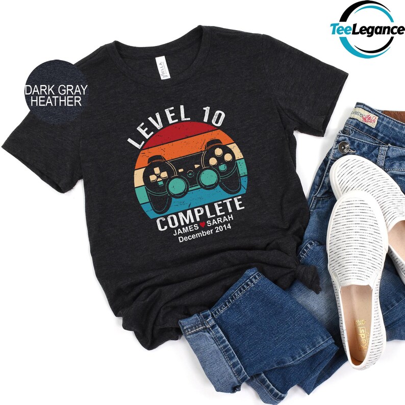 a t - shirt with a video game controller on it