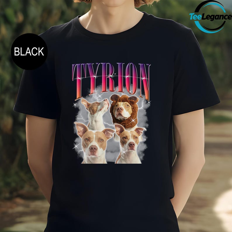 a woman wearing a black t - shirt with two dogs on it