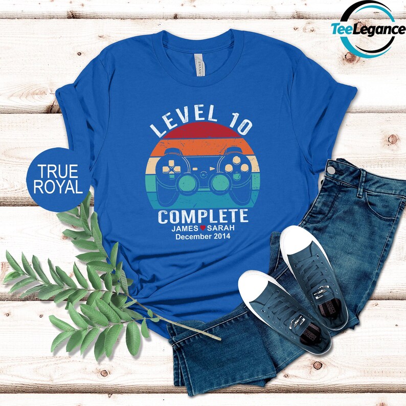 a t - shirt with a video game controller on it