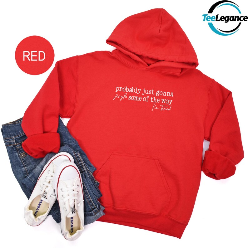 A red hoodie with the text "probably just gonna some of the way" printed on it, along with a pair of jeans and white sneakers.