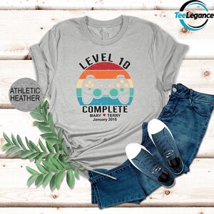 a t - shirt with the words level 10 complete on it