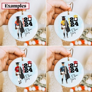 May include: Four round white ceramic ornaments with a baseball player wearing a graduation cap and gown. Each ornament has a red, white, and blue baseball, the text "Class of 2024", and the name "Ethan Jones".