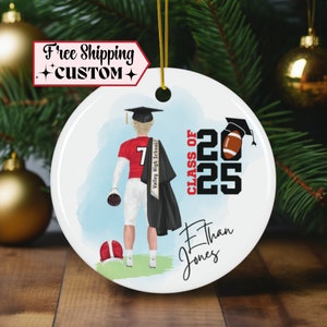 May include: A white ceramic ornament with a blue watercolor background. A cartoon illustration of a football player wearing a graduation cap and gown. The text "CLASS OF 2025" is in black and red. The player's name is "Ethan Jones" and the school is "Valley High School".
