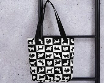 May include: Black and white tote bag with a repeating pattern of stylized animals, including a rooster, a sheep, a dog, and a cow.