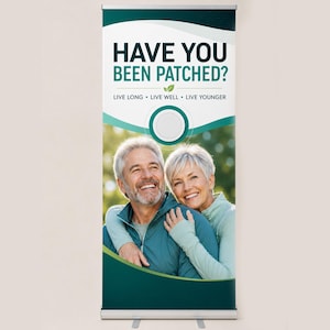 May include: A retractable banner with the text "HAVE YOU BEEN PATCHED?" in teal and black. The banner also includes the phrases "LIVE LONG • LIVE WELL • LIVE YOUNGER" and a photo of a smiling couple.