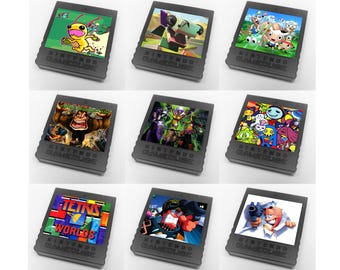 Op de afbeelding: Negen Nintendo GameCube-gamecartridges. Elke cartridge heeft kleurrijke game-art, inclusief personages en logo's. De cartridges zijn grijs met de woorden "NINTENDO GAMECUBE" erop gedrukt. De games omvatten Tetris Worlds en andere titels.