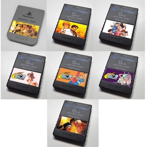 May include: Eight black PlayStation 2 memory cards with different game character designs. The cards are 8MB and feature characters from the games 'The King of Fighters', 'Guilty Gear', and 'Street Fighter'.